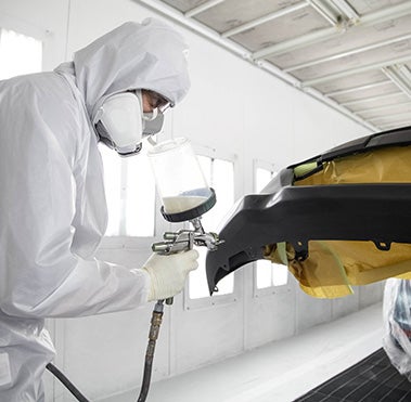 Collision Center Technician Painting a Vehicle | Moses Toyota of Morgantown in Morgantown WV